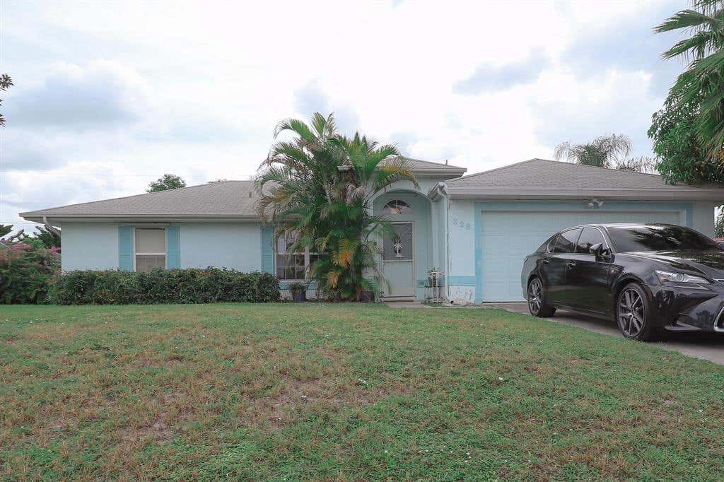 Photo of 326 SW Covington Road, Port Saint Lucie, FL 34953 (MLS # R10754191)