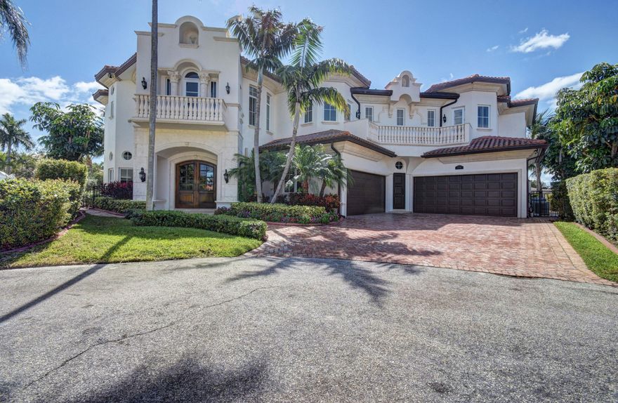 Stunning point lot views from this cul-de-sac 6 bedroom, 6.5 bath estate home located on 200 plus ft of extraordinary deep water. Huge master suite with separate his & hers bathrooms, sitting area and expansive covered balcony to enjoy the breeze and watch boats go by on the intracoastal. Huge club room with wet bar, 4 car garage,FP living/dining room, gourmet kitchen w/WOLF appliances and solid wood custom cabinetry,designer marble floors thruout lower level,crestron lighting system, temperature control wine cellar, gorgeous wood spiral staircase w/ wrought iron rails, wood floors on the upper level. Entertain on the large covered veranda overlooking the pool & waterway w/ summer kitchen & bar. Full house generator and impact glass. This has absolutely everything! Spectaclular wide canal