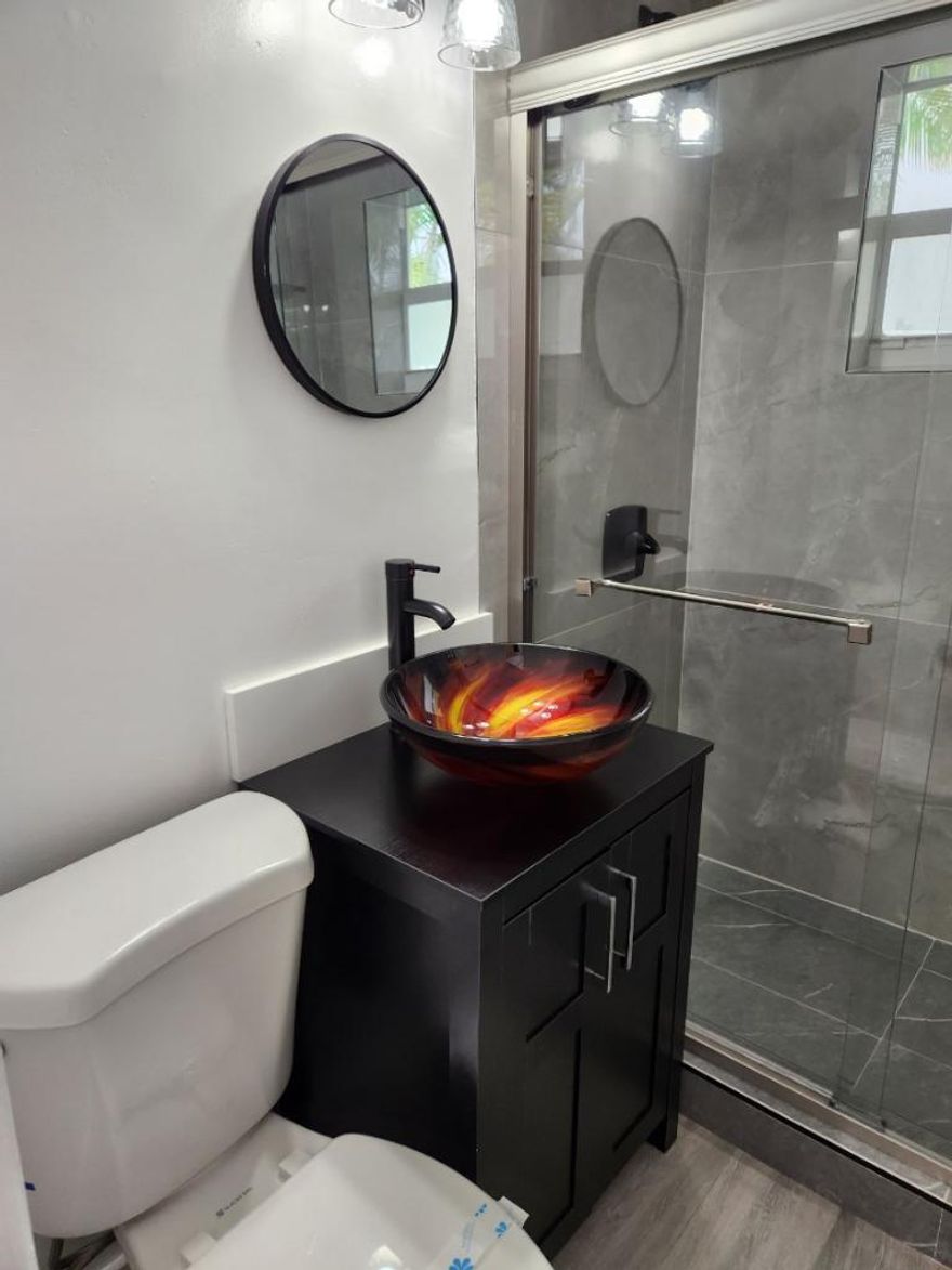 Unique investment opportunity to acquire a fully renovated, turnkey 8-unit apartment building situated on a generous 12,516 SF lot just half a block from Biscayne Bay in Miami's highly desirable Shorecrest neighborhood. Recently renovated in 2023, the property features a beautifully landscaped courtyard, on-site laundry facilities, and 9 dedicated parking spaces—an exceptional amenity for the area. The unit mix and upgrades position the asset for immediate income generation with strong rental upside. The property is zoned T-5-R, offering significant long-term redevelopment potential. Investors have the option to reimagine the site into a boutique 5-story hotel, condominium, or expanded multifamily project, potentially capturing bay views and maximizing density. Alternatively, this is an  ideal long-term hold in a rapidly appreciating submarket, with increasing rental demand driven by proximity to Biscayne Bay, MiMo District, and ongoing neighborhood revitalization. Also nearby include waterfronts, parks, boutiques, restaurants, and key commuter routes with a short drive to I-95. With full occupancy and strong tenant retention, this property combines dependable cash flow with future growth potential in one of Miami's most dynamic submarkets. Prime location East of Biscayne Boulevard and half a block to Biscayne Bay, places it West of North Bay Village, North Beach & Nearby Surfside, 20 Min Drive to the Beach and positioned North West of Miami Beach/South Beach.