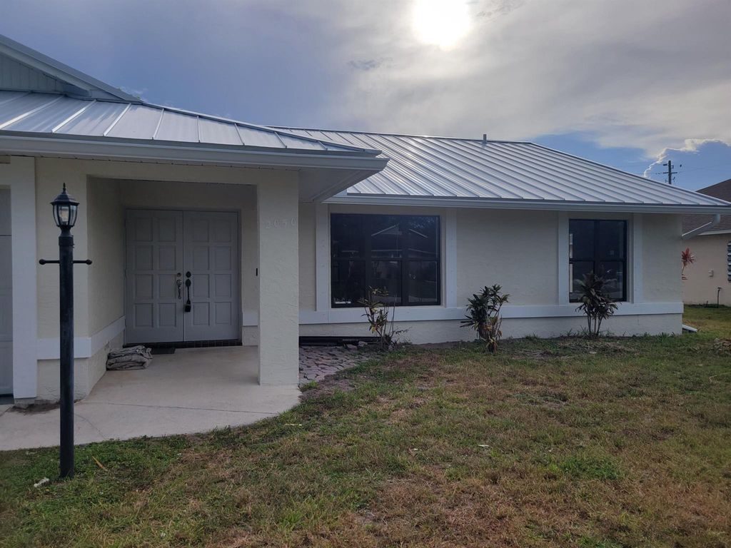 Photo of 2050 SE Camilo Street, Port Saint Lucie, FL 34952 (MLS # R11114271)