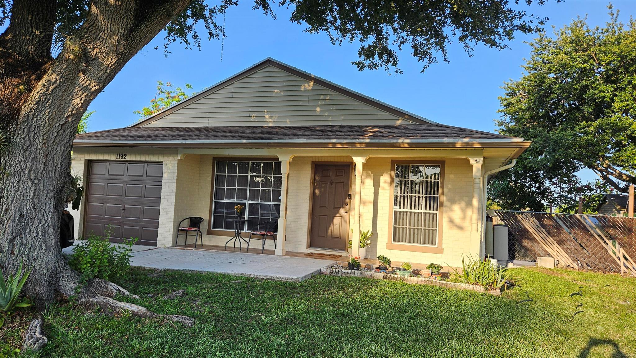 Discover this charming 3-bedroom, 2-bathroom home with NO HOA in the heart of Royal Palm Beach! Featuring a new roof installed in 2021, this well-maintained property offers peace of mind and modern appeal. Enjoy a spacious patio area with pavers, perfect for relaxing or entertaining guests. Conveniently located just 1 mile from 441 and minutes from Walmart, top-rated schools, and major shopping centers. Nestled in a community with nearby parks and outdoor spaces, this home combines comfort, location, and freedom with no association restrictions!