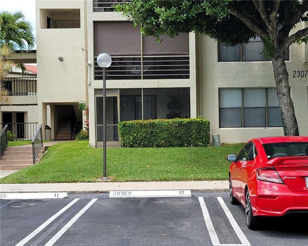 Photo of 2307 S Cypress Bend Drive #208A, Pompano Beach, FL 33069 (MLS # F10400289)