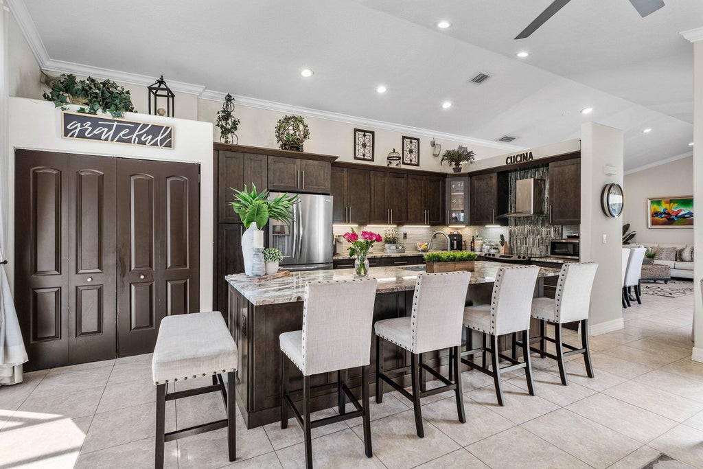 Photo of 5054 Prairie Dunes Village Circle, Lake Worth, FL 33463 (MLS # B26081691)