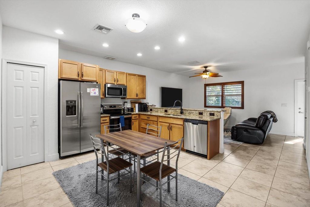 Photo of 1007 NE Trailside Run, Port Saint Lucie, FL 34983 (MLS # R11160389)