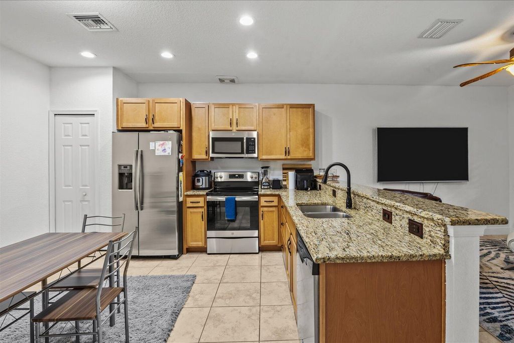 Photo of 1007 NE Trailside Run, Port Saint Lucie, FL 34983 (MLS # R11160389)