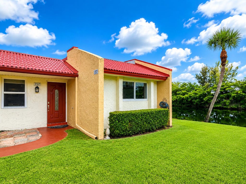 Photo of 157 LAKE ANNE Drive, West Palm Beach, FL 33411 (MLS # B26057873)