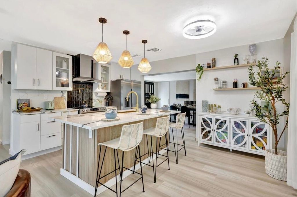 Photo of 115 W 31st Court, Riviera Beach, FL 33404 (MLS # R11167660)