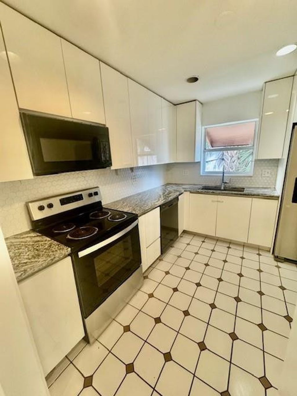 Photo of 1134 Pine Tree Dr, Lantana, FL 33463 (MLS # F10544189)