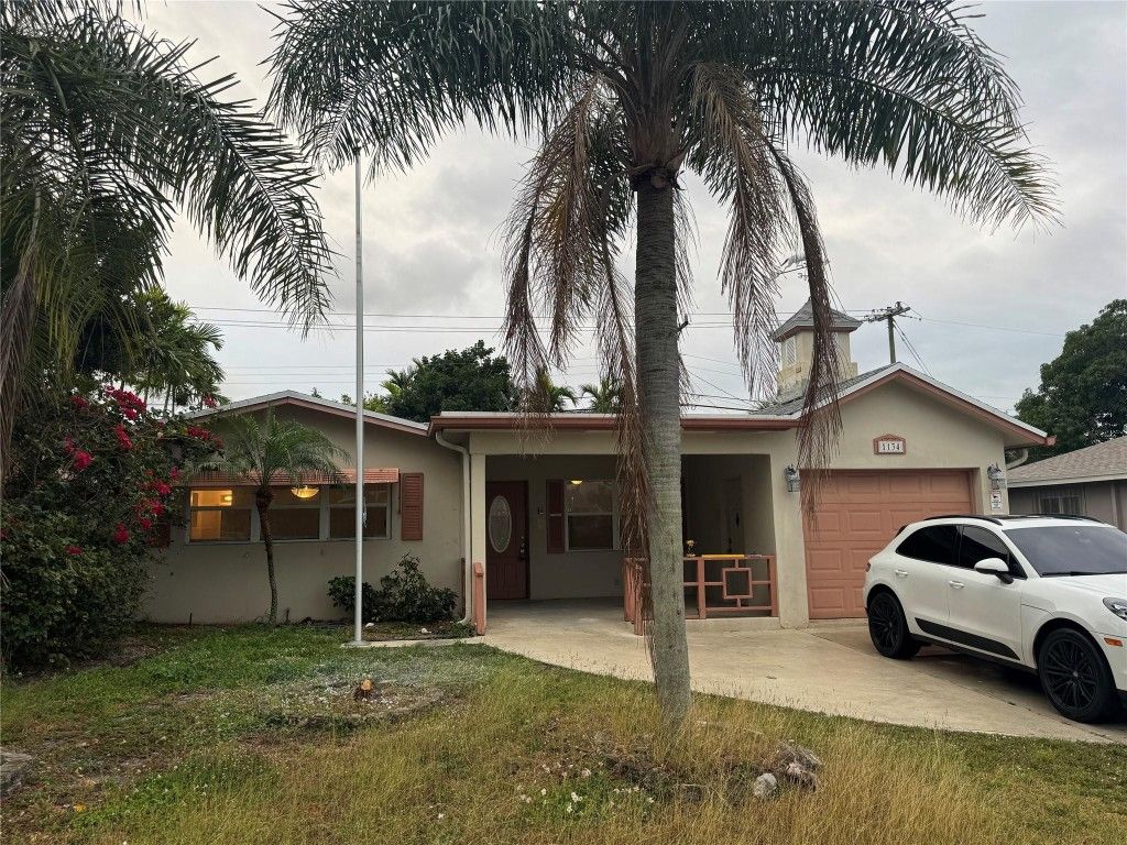 Photo of 1134 Pine Tree Dr, Lantana, FL 33463 (MLS # F10544189)