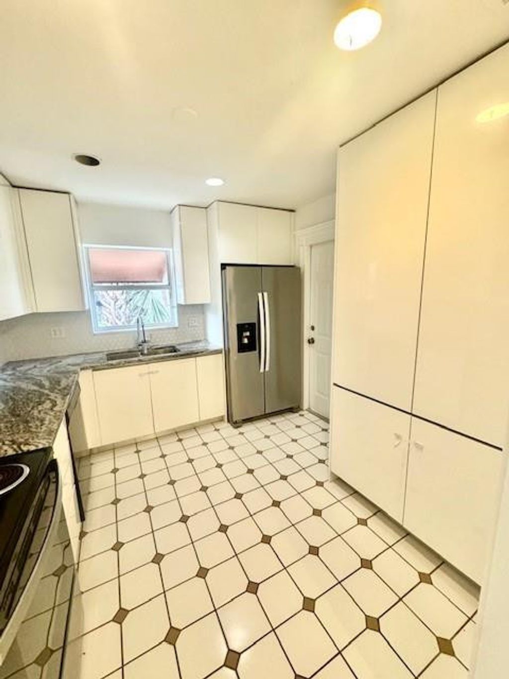 Photo of 1134 Pine Tree Dr, Lantana, FL 33463 (MLS # F10544189)