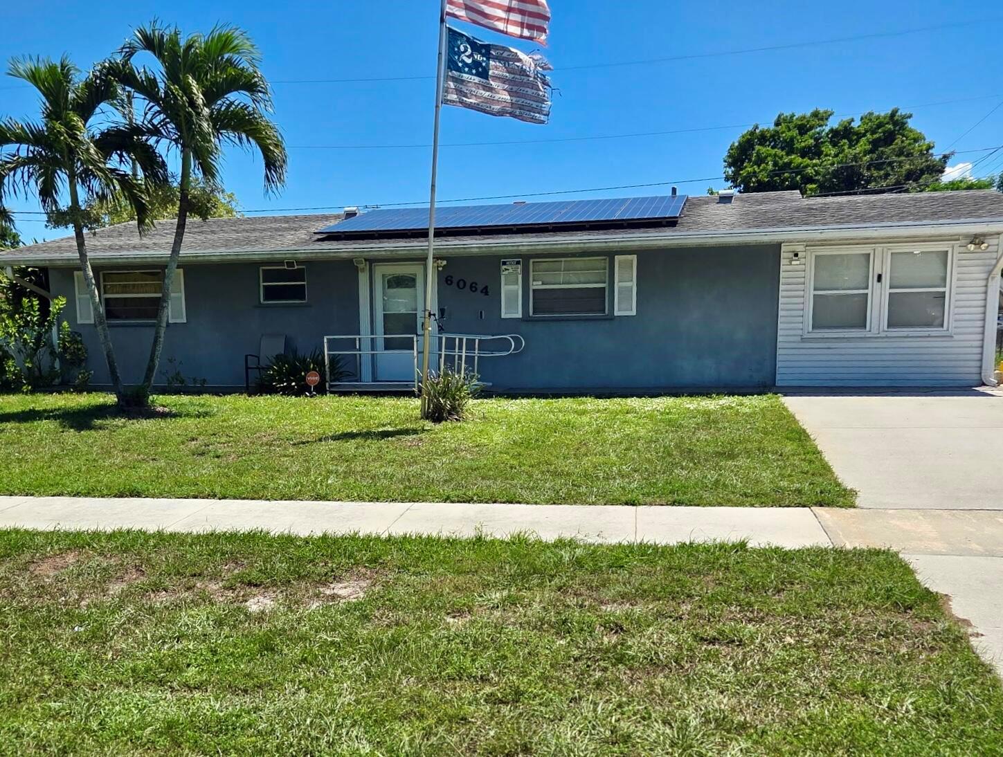 Charming Ranch on Corner Lot! This 4 bedroom, 2 bath ranch-style home sits on a spacious corner lot in a well-established neighborhood. Built with solid concrete block and stucco, it features a flexible floor plan with a converted garage that adds a versatile fourth bedroom or office. The backyard offers room for a future pool plus has a storage shed large enough for tools and a riding mower. Conveniently located near the Florida Turnpike, I-95, Palm Beach International Airport, and great shopping, this home is full of potential in a prime location.