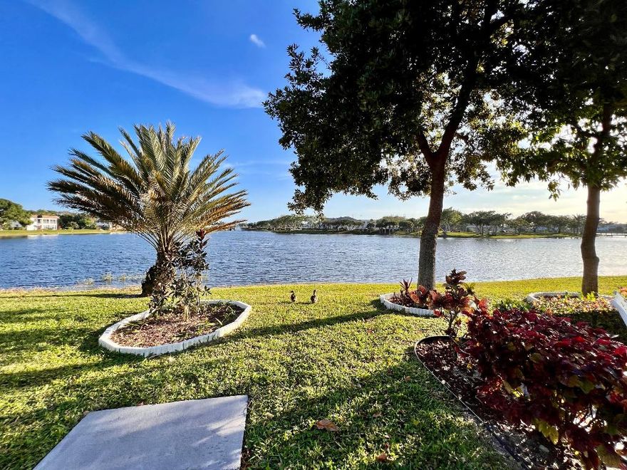 Waterside Building in 55+ Century Village!  Lovely & Spacious Stratford Section 2/2 With Numerous Updates and Peaks of the Lake from the Den! Bright & Pretty Updated Kitchen With White Cabinets, Window Over Sink, High Hat Lights, and White Appliances. Den/Alcove Offers Extra Space, Extra Storage, and a Water View! Split Bedroom Plan. WOW -- In Unit Stackable Washer & Dryer! Neutral Tile Flooring Throughout. Impact Windows. Chair Stair Lift. Sold AS IS & Furnished (some items excluded). Wonderful Location Central To the Main Clubhouse & Hastings Fitness Center. Waterside Resident Patio With Gorgeous Wide Water Views! Stratford J Is A No Smoking Building. Century Village Is A 55+ Resort Style Community With So Much To Offer... shows, movies, clubs, pools, security, and transportation service. The Clubhouse features a theater, indoor pool, card room, community/party room, billiard room, shuffleboard, tennis, pickleball, bocce, and two outdoor pools. Numerous heated outdoor pools throughout the community. Separate fitness center with gym and outdoor heated pool & resistance pool. Two guarded gates and 24-hour roving security patrol.
