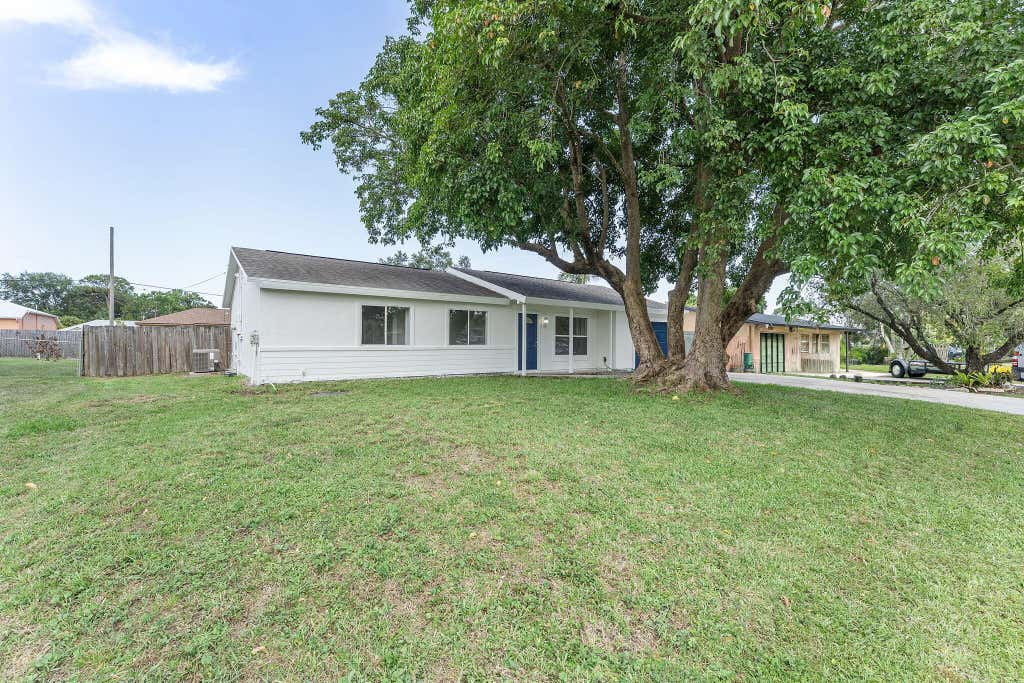 Photo of 1041 SE Spinnaker Ave, Port Saint Lucie, FL 34983 (MLS # R11104375)