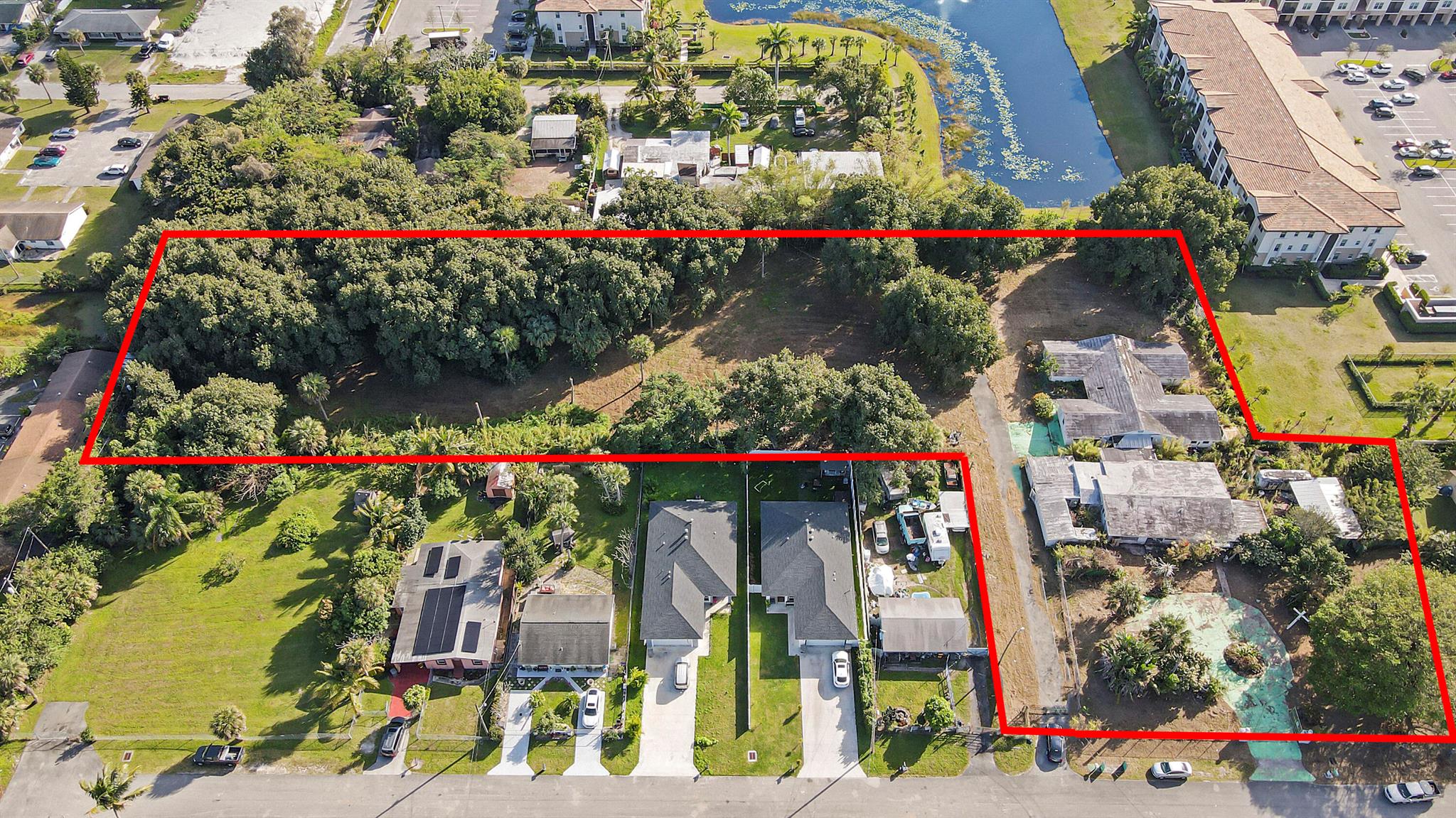 Unleash your development potential with this incredible 2.7 acre parcel of land located in West Palm Beach, Florida! As a developer, you recognize prime real estate, and this property is perfect for constructing 13 single family homes or 6 Triplexes (exact numbers subject to county approval). The flat, easily developable land in this highly desirable area makes for an excellent investment opportunity. This is a rare and valuable property, so take the first step towards your next project and create a thriving community in this unbeatable location!