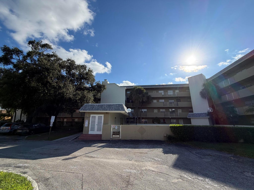 Photo of 3120 N PINE ISLAND Road #403, Sunrise, FL 33351 (MLS # B26089332)