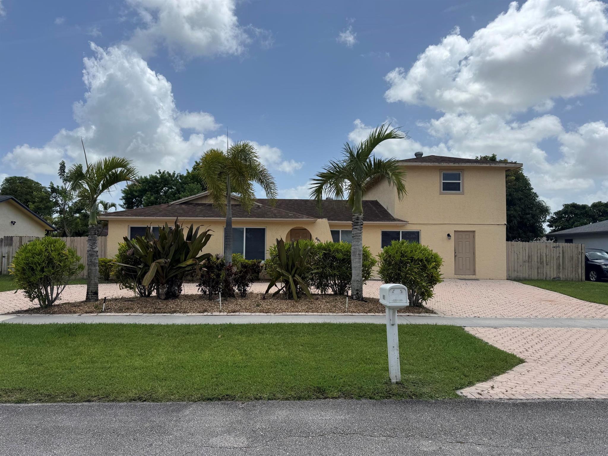 Incredible opportunity to rent a spacious pool home suitable for 2 families. Main house is a 3 bedroom/ 2 bathroom with an open kitchen and laundry inside. Attached is a 2 story guest house with 1/2 bath and separate kitchen downstairs and 2 bedrooms/ 1 bathroom upstairs.Guest house has it's own separate laundry upstairs. Modernized with porcelain tile floors and impact windows throughout. Great for in- laws or extended family living.