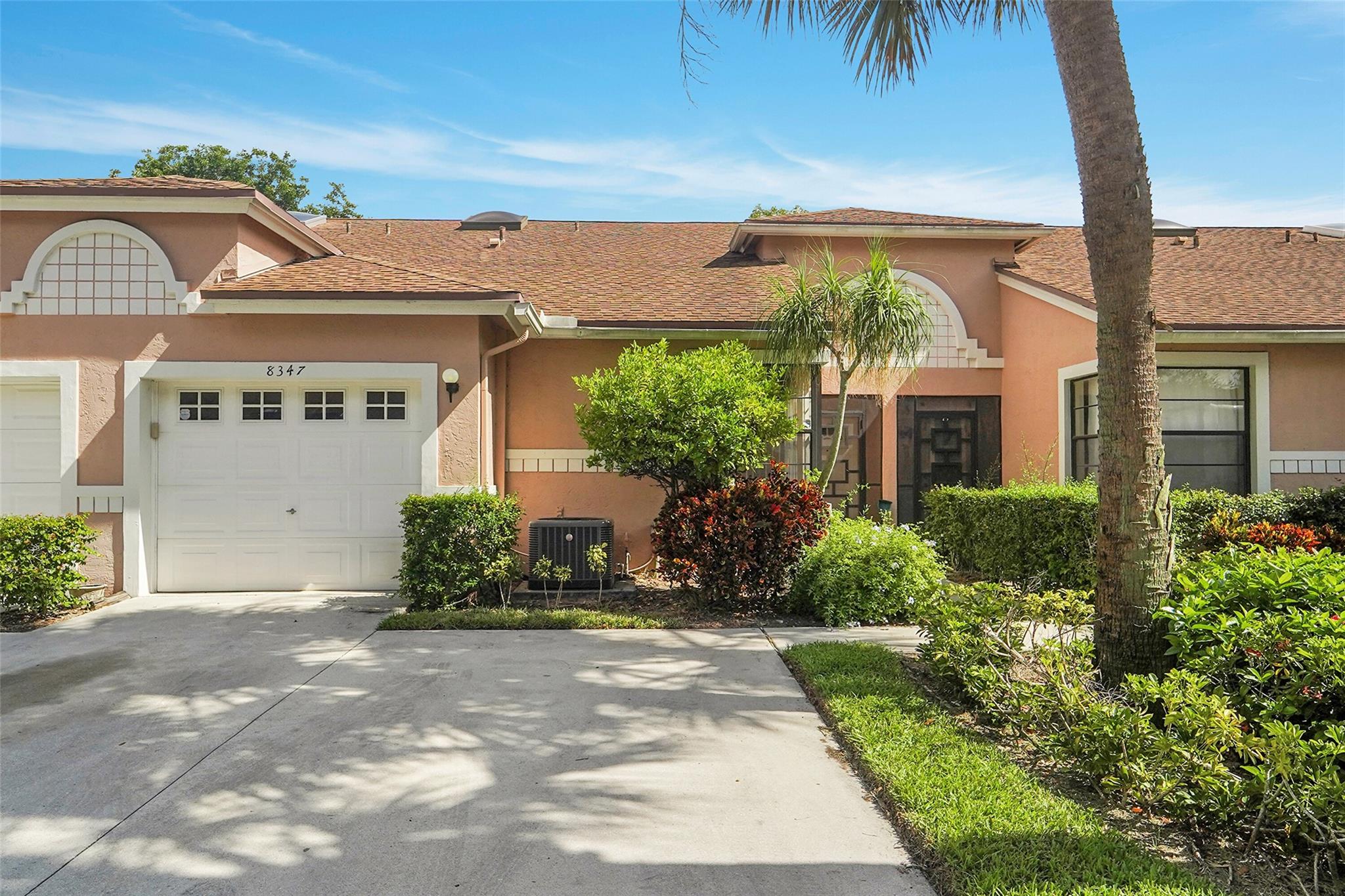 Step into the possibilities with this rarely available, oversized 2-bedroom, 2-bath villa condo with a versatile flex space--perfect for a home office or den. Nestled within the gated 55+ community of Whisper Walk, this well-maintained residence is in nice condition and filled with natural light, creating a warm and welcoming ambiance. The thoughtfully arranged layout includes a spacious kitchen with granite countertops, separate laundry room and attached 1 car garage. The large primary suite boasts a custom walk-in closet and private en-suite bath. Whisper Walk offers a serene, park-like setting with beautifully landscaped grounds and exceptional amenities designed for an active lifestyle. The lake views from this beautiful property are so peaceful & relaxing. Come see it for yourself.