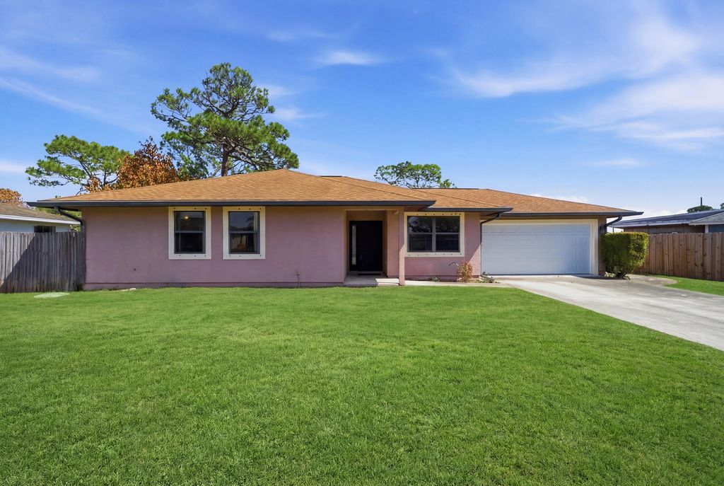 Photo of 2261 SE Southeast Glover St, Port Saint Lucie, FL 34984 (MLS # B26000926)