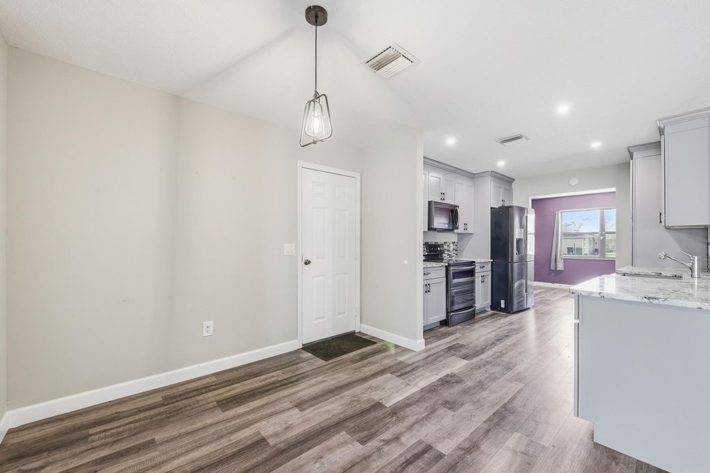 Photo of 2261 SE Southeast Glover St, Port Saint Lucie, FL 34984 (MLS # B26000926)