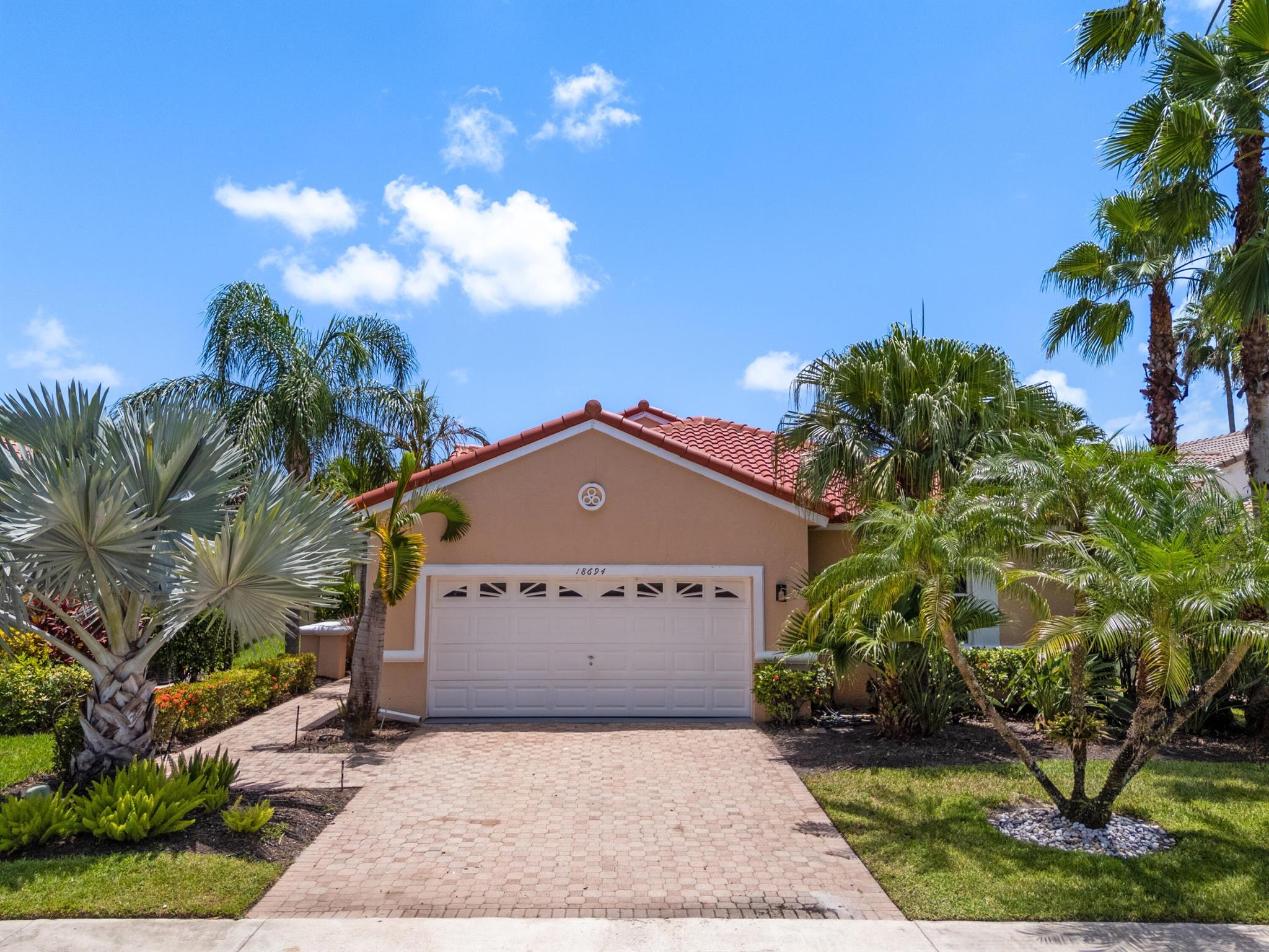 Welcome home to this 4/3 house in the highly sought-after neighborhood of The Shores at Boca. Amazing water view offers serenity. BRAND NEW ROOF. Brand new large 48x48 luxury rectified tiles inmain floor and vinyl floors in guest bedrooms. Brand new kitchen featuring high end cabinets and white quartz countertop and a largeisland. Brand new stainless appliances. All new bathrooms including large framelss showers, new vanities with quartz countertops. LED recessed lighting in main living area. 2022 AC. Large and bright living room, dining room and familyroom. Minutes away from great schools, restaurants, parks etc. Community has a clubhouse, fitness center, pool, basketball and tennis courts, 24/7 mannedgate, internet included