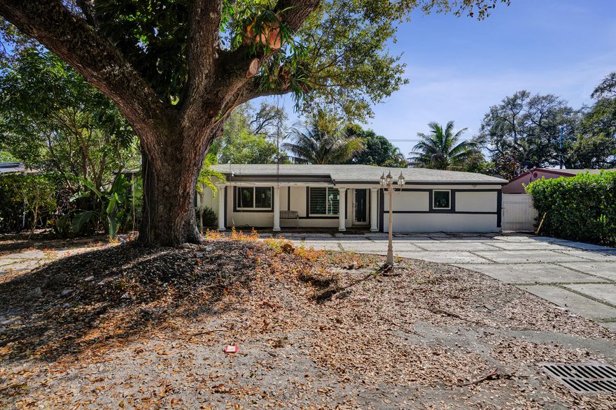 Spacious and beautifully updated, this 3-bedroom, 2-bath home offers comfort, style, and peace of mind. Recent upgrades include impact windows, a newer roof, and a modern kitchen designed for everyday living and entertaining. The excellent floor plan features a bright family room, all-tile flooring, and fresh interior paint throughout. Enjoy relaxing on the screened porch overlooking a lush, fenced backyard with mature landscaping and an automatic sprinkler system. Additional highlights include a workshop, a 2-car garage with openers, and plenty of room for storage and hobbies. Located in a welcoming neighborhood with great neighbors, this well-maintained home truly has it all.