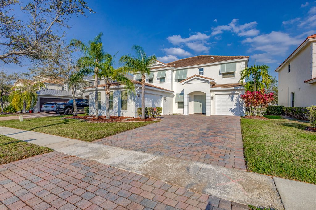Photo of 118 Palm Beach Plantation Boulevard, Royal Palm Beach, FL 33411 (MLS # B26012892)