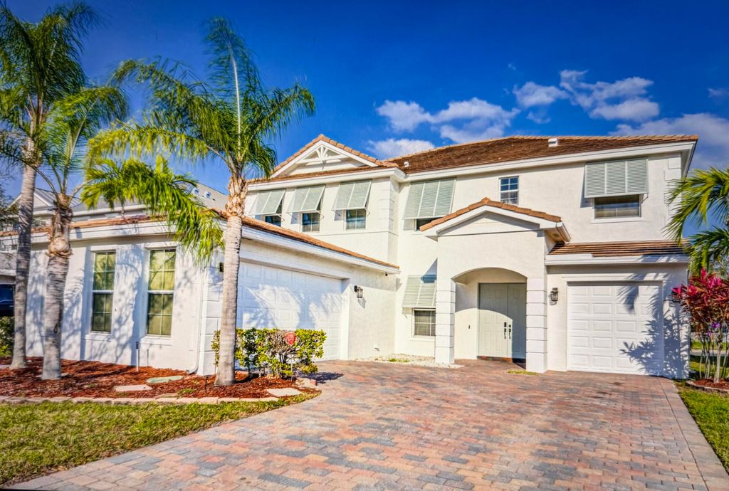 Photo of 118 Palm Beach Plantation Boulevard, Royal Palm Beach, FL 33411 (MLS # B26012892)