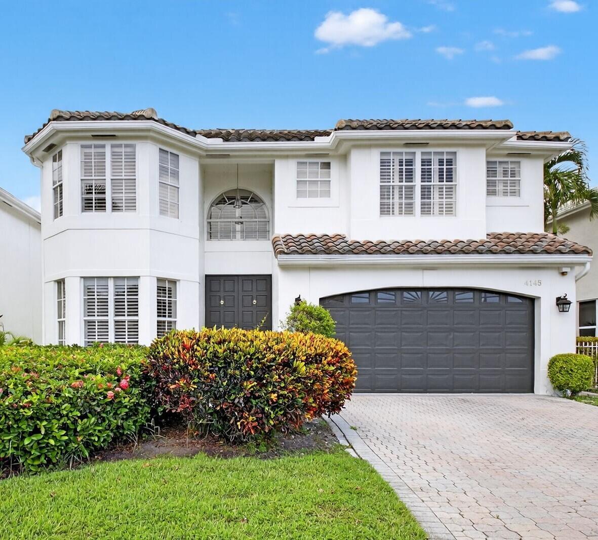 Own in Woodfield CC before equity membership increases $50,000 on November 1, 2025! This updated 4-bdrm, 2.5-bth home offers luxury living with picturesque golf course views & an exclusive lifestyle in a community known for its top-tier amenities, state-of-the-art fitness center & spa, children's clubhouse, pools, fine & casual dining, tennis & pickleball. Enjoy an impressive open layout with soaring volume ceilings & sleek white modern porcelain tile floors throughout the main living areas. The renovated kitchen has quartz countertops, modern cabinetry, & a clean, contemporary design. The primary bedroom is conveniently situated on the first floor. Upstairs, you will find three spacious bedrooms ideal for family, guests, or a home office. All bedrooms have white plantation shutters.