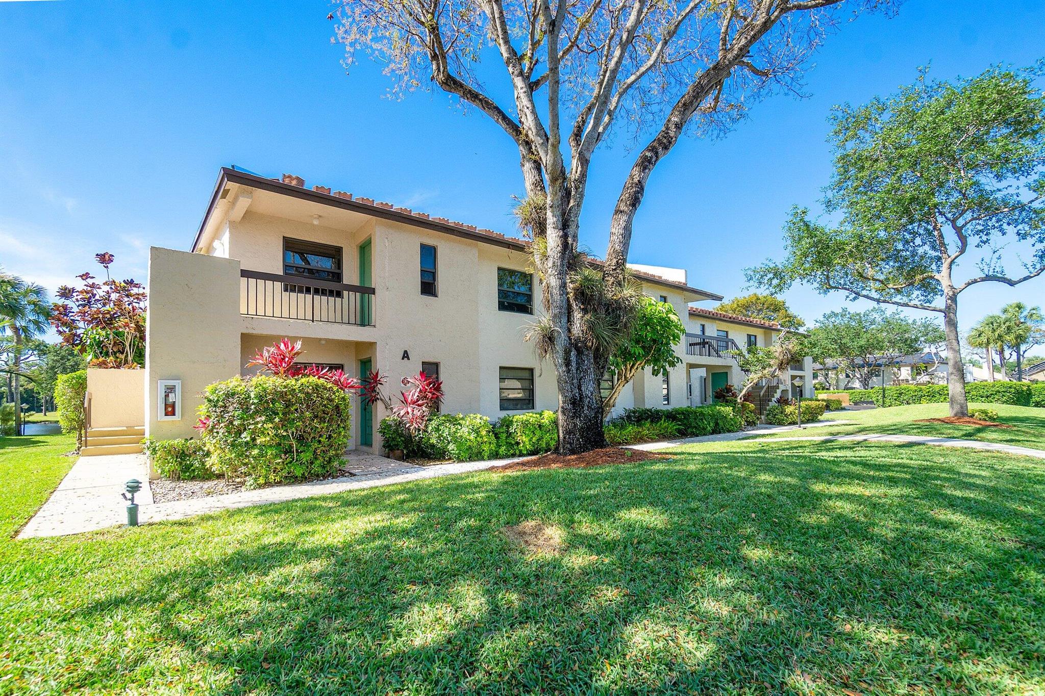 Experience a country club setting without the mandatory fees. Boca Lago Country club, no membership required. Updated 2/2 on the second floor. Great floor-plan, corner unit with Lake view and Golf Course Hole #6 views, tile throughout, Italian style kitchen cabinets with quartz countertops and stainless steel smart appliances. Building has been painted, new roof, exterior is well-kept. A-rated schools. Golf, tennis, lakes and heated pool. ALL AGES. Perfect for student or working professionals. Great central location with EZ access to Turnpike, I95, Town Center Mall, beaches, shops and restaurants. Offeredpartially furnished or unfurnished.