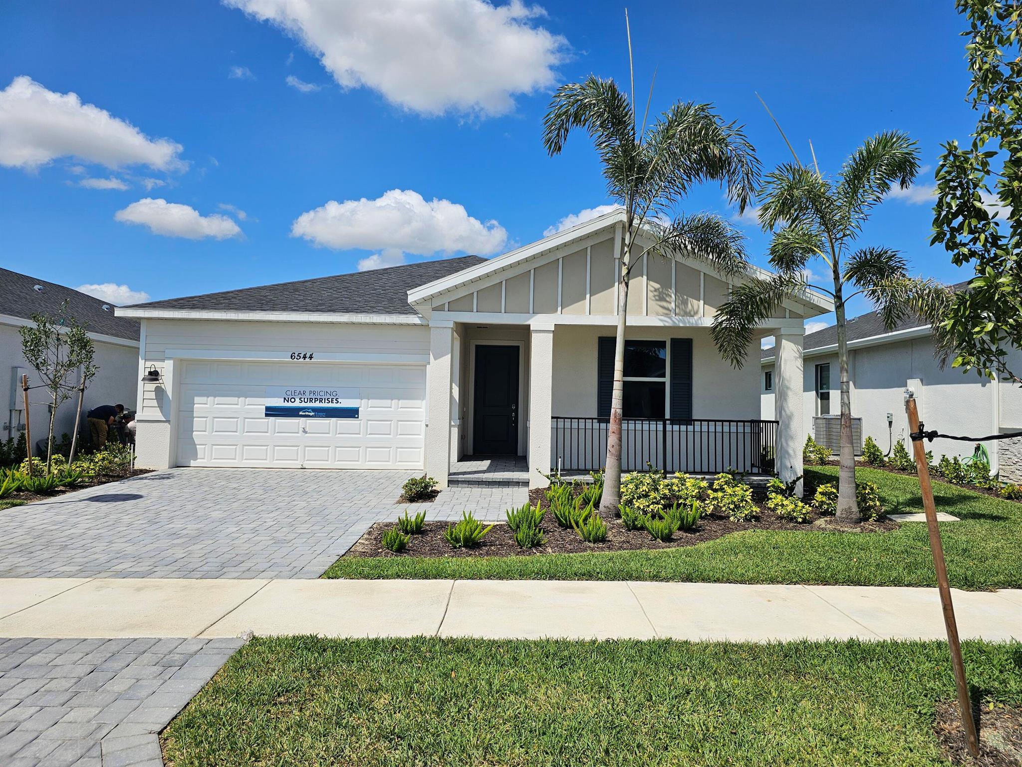 This stunning, new construction resale home, built in 2023, is located in the desirable Brystol at Wylder community, adjacent to Glylea Country Club. This spacious single-family home features 4 bedrooms and 2 bathrooms, all protected by impact windows and doors, providing both safety and energy efficiency.Step inside to discover a meticulously maintained home with modern amenities. The seamless gutters and sprinkler system make for easy exterior maintenance. The home is part of the Wylder master-planned community, offering resort-style amenities, scenic trails, and a beautiful lakefront area. With a 2-car garage and a thoughtful floor plan, this home is perfect for comfortable living and entertaining.