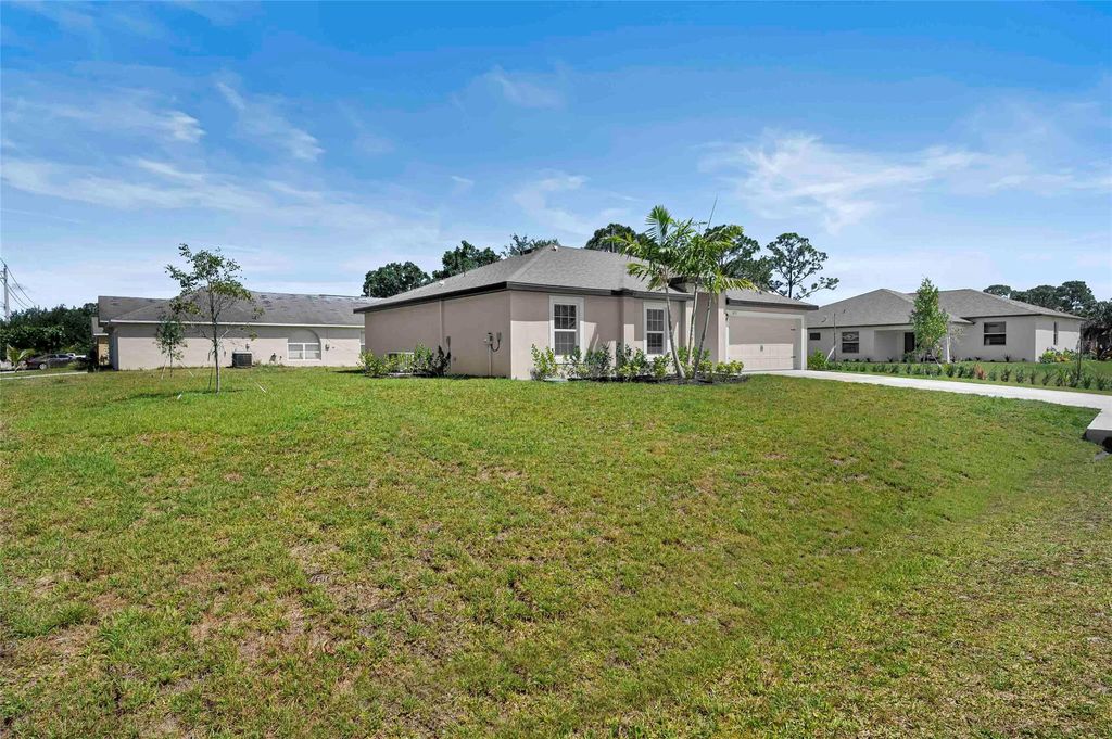 Photo of 1697 SW Hunnicut Avenue, Port Saint Lucie, FL 34953 (MLS # F10464953)