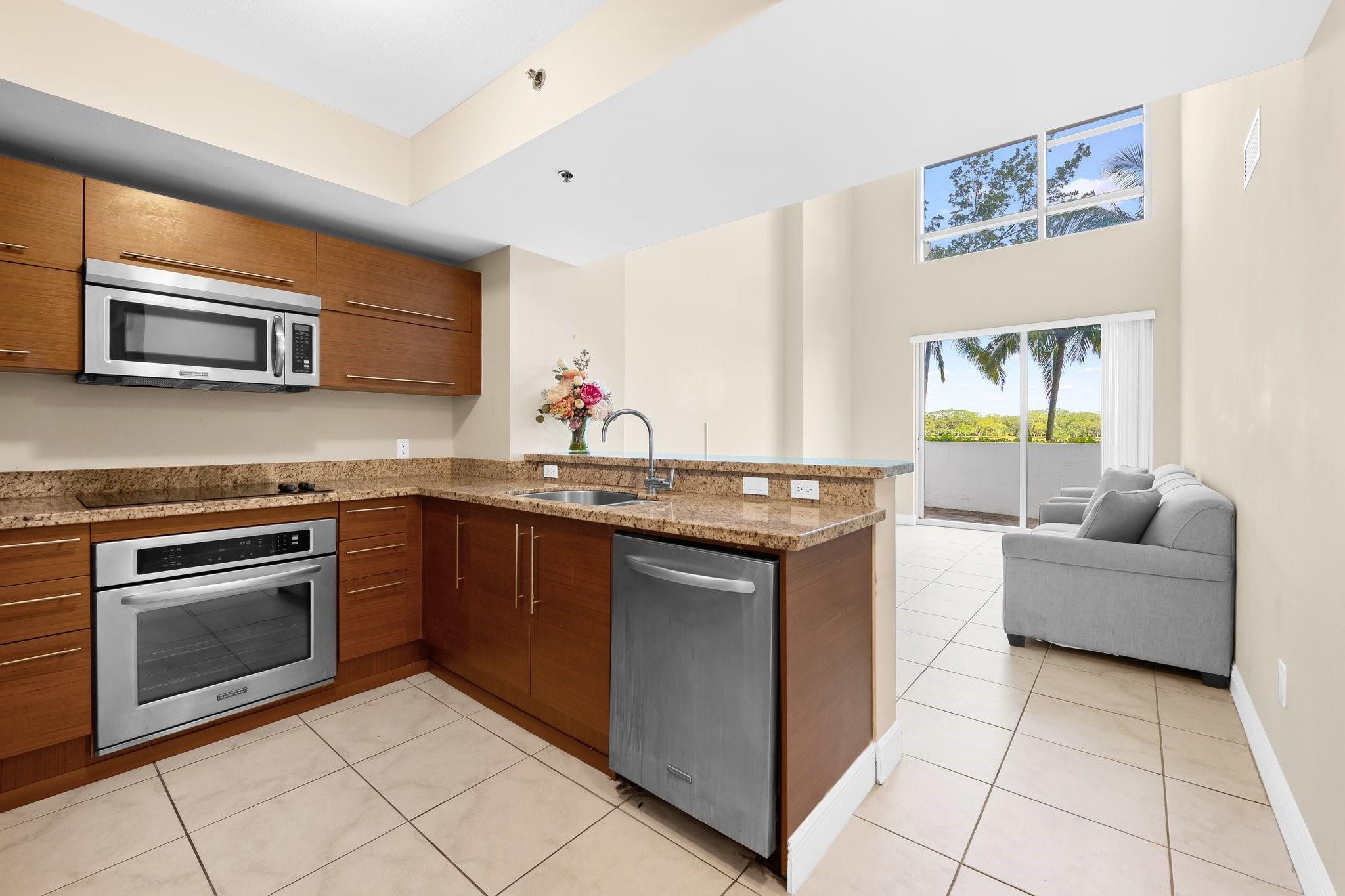 Welcome to your dream condo at 2641 N Flamingo Road, Unit TH7 N. This inviting townhome features 2 spacious bedrooms and 2 luxurious bathrooms within 1,848 square feet of modern living space. Experience breathtaking lake views from the main living area and primary bedroom, complemented by impressive volume ceilings that enhance the sense of openness. Enjoy a flexible bonus room/den that can serve as a third bedroom or dining room, & a loft perfect for a home office or nursery. Step outside to your private patio, or relax on the balcony and take in the views. Conveniently located close to shopping, dining, & entertainment, right off the Sawgrass & 595! Community amenities include a stunning pool, sauna, gym, & more. Best priced townhouse in the building, ready for you to call home!