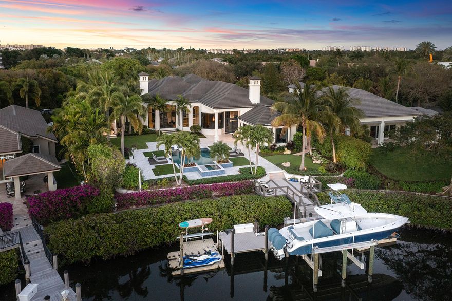Boasting over 96' of water frontage in one of the most prime waterfront locations seconds to the intracoastal. As you enter the grand foyer, you are greeted with waterfront views through floor to ceiling windows creating a comforting bright and airy space. An entertainer's dream with a Chef's Kitchen complete with SZ appliances, coffee station, bar area, additional ice maker, wine coolers and custom storage. First floor expansive master bedroom with his and hers custom closets vanities and showers! Three additional suites in the main house and a one bed guest house overlooking the over sized pool and neighboring yachts. Upgraded everywhere from new roof to hurricane impact widows! Designer furnishings included!