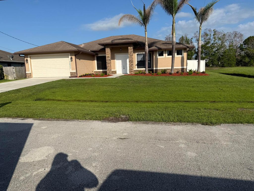 Photo of 5831 NW Dooley CIR, Port Saint Lucie, FL 34986 (MLS # B26029192)