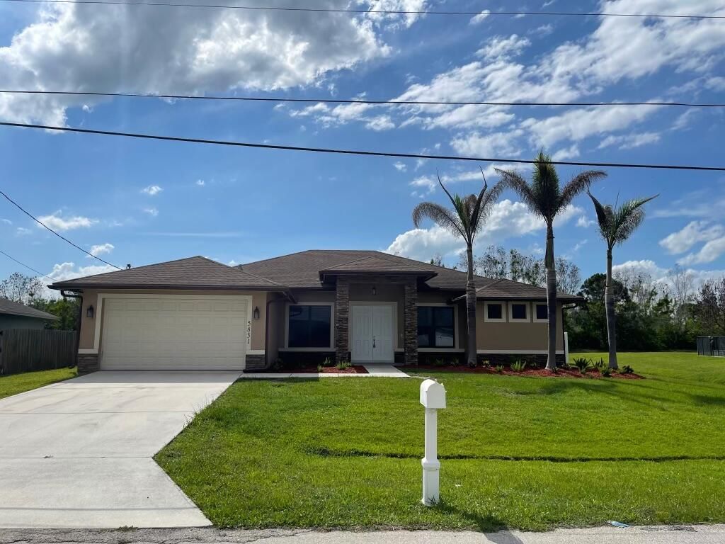 Photo of 5831 NW Dooley CIR, Port Saint Lucie, FL 34986 (MLS # B26029192)