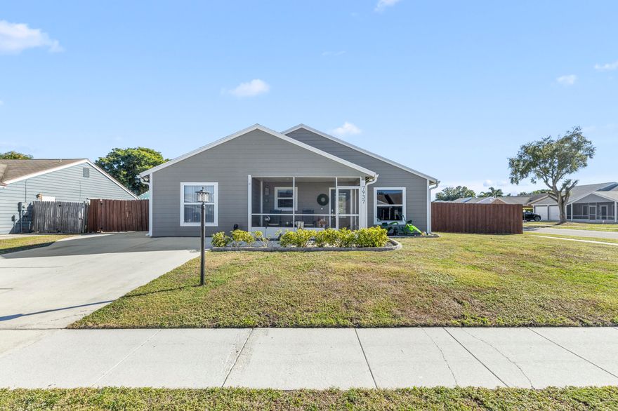 Rare oversized corner lot with pool in Country Lakes West! Upgraded contemporary home with 3 large bedrooms and 2 baths (3rd bedroom has no closet--easy to add).Open-concept layout with vaulted textured ceilings, high-hat lighting, textured walls, and brushed nickel finishes. Kitchen features granite counters and back splash, stainless steel appliances, and black cabinetry. LVP flooring throughout. Primary suite offers a custom closet by The Container Store. Backyard oasis with resurfaced pool (2023), mesh safety fence, white rock landscaping, and spacious brick paver patio. Extended driveway fits boat/RV plus 5-car parking. Screened front patio, impact windows/doors, 2015 roof & water heater, 2025 AC with 10year warranty,,new 2022 gutters.