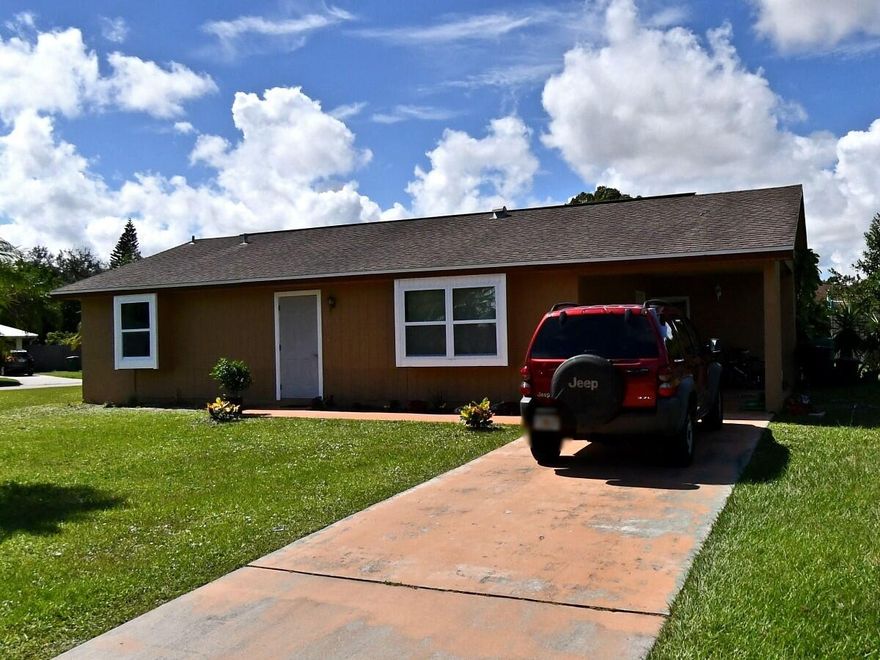 BEAUTIFUL CORNER HOME WITH HUGE BACK YARD IT HAS A CARPORT WITH A LONG CONCRETE DRIVEWAY  THE HOUSE HAS LOTS OF WINDOWS FOR NATURAL  LIGHT . TONS OF POTENTIAL TO BUILD A HUGE POOL OR EXTEND THE HOUSE IN EVERY DIRECTION ,.WALKING DISTANCE TO HCA HOSPITAL  AND  CVS PHARMACY
