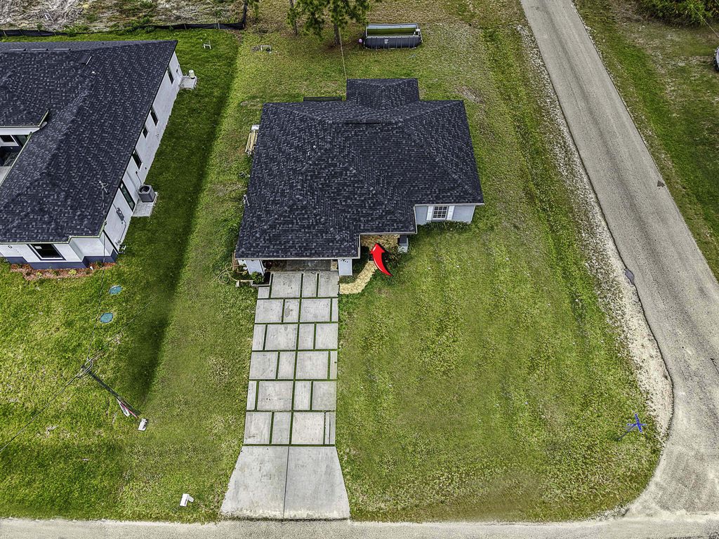 Photo of 2900 W 42nd St Street W, Lehigh Acres, FL 33971 (MLS # B26008349)