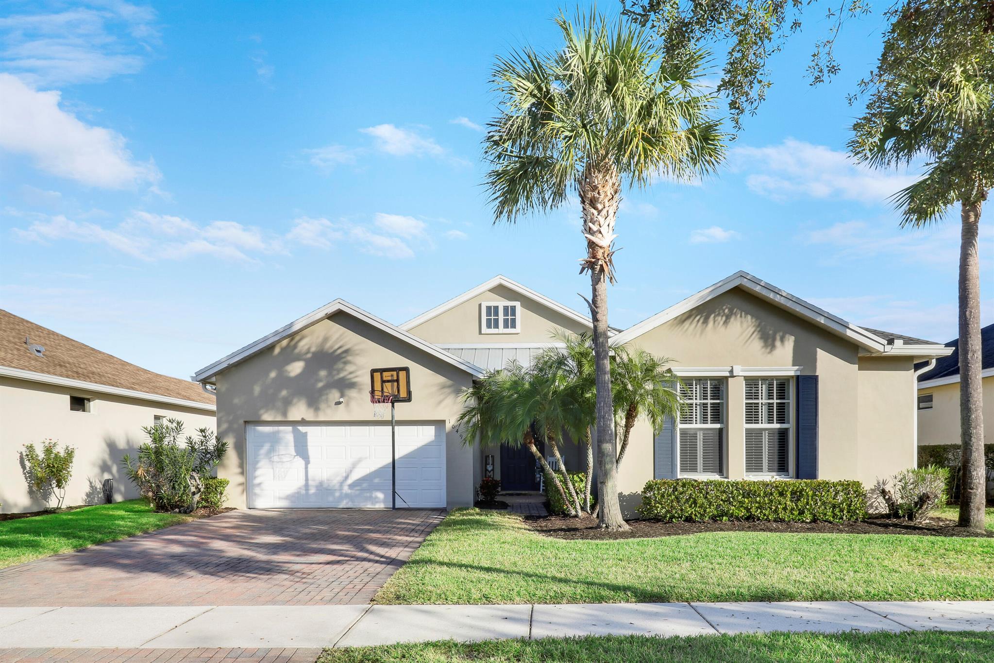 Enjoy all the perks of Tradition including parks, A-rated schools, restaurants shopping & more! Introducing this stunning 4BR, 2.5BA home with 2-car garage & metal roof. Bright open floor plan features an updated kitchen with quartz countertops, shaker soft-close cabinets, stainless steel appliances, cooktop & wall oven. LVP flooring, plantation shutters while crown molding in bedrooms add a touch of elegance. Spacious primary suite with walk-in closet & updated guest bath. Step outside to a heated saltwater pool & hot tub, paver deck with child safety gate, and fully fenced PVC yard for added privacy--perfect for relaxation & entertaining!