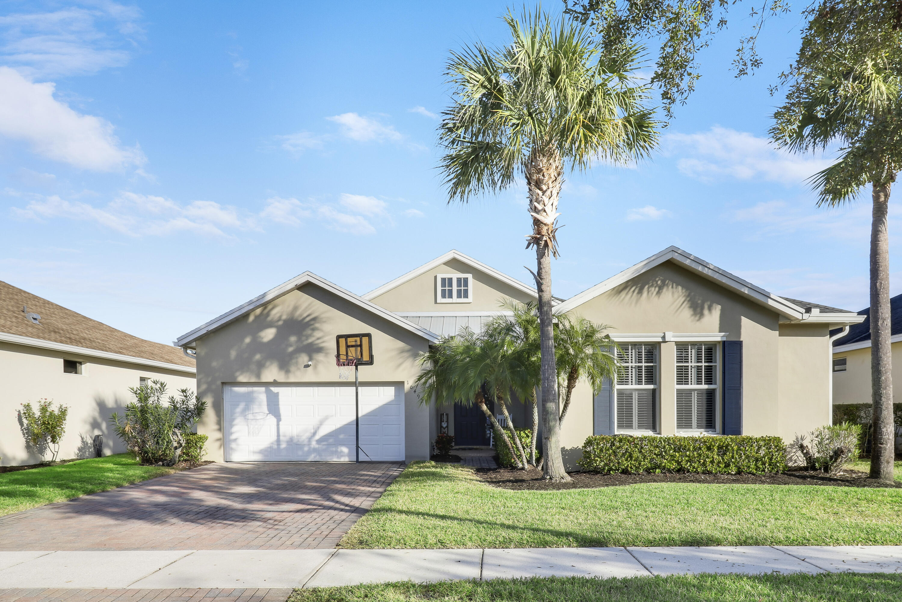Enjoy all the perks of Tradition including parks, A-rated schools, restaurants shopping & more! Introducing this stunning 4BR, 2.5BA home with 2-car garage & metal roof. Bright open floor plan features an updated kitchen with quartz countertops, shaker soft-close cabinets, stainless steel appliances, cooktop & wall oven. LVP flooring, plantation shutters while crown molding in bedrooms add a touch of elegance. Spacious primary suite with walk-in closet & updated guest bath. Step outside to a heated saltwater pool & hot tub, paver deck with child safety gate, and fully fenced PVC yard for added privacy--perfect for relaxation & entertaining!
