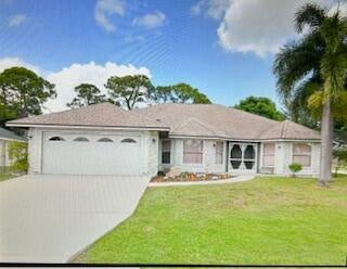 Photo of 881 SE Lansdowne Avenue, Port Saint Lucie, FL 34983 (MLS # R10987400)