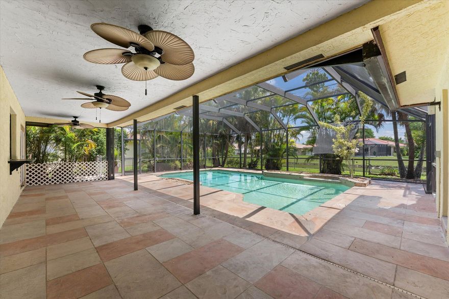 Don't miss touring this stunning residence — a tropical paradise in Coral Springs! This beautifully maintained 4-bedroom, 2-bathroom pool home sits on a premium lot with lush greenery and tranquil water views, creating a cozy five-star retreat ambiance perfect for relaxing and entertaining. Step into a welcoming foyer and grand living space filled with natural light, soaring vaulted ceilings, and open-concept living areas with beautiful views of the pool, canal, and tropical surroundings from the living room, kitchen, and breakfast nook. The kitchen overlooks the screened-in pool and expansive patio area, creating the perfect indoor-outdoor flow for lounging, entertaining guests, or enjoying backyard barbecues year-round. Additional features include a new A/C, 2 renovated bathrooms,  and laundry room.  Great location, close to the highway, restaurants, shopping and schools.