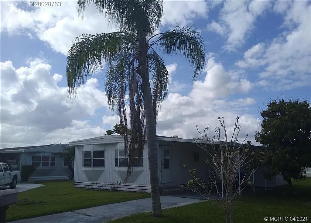2 bedroom 2 bath being sold with new Floors through the home. Kitchen Painted ..Near New $10,000 AC unit with warranty transferable. LOT rent to new buyer