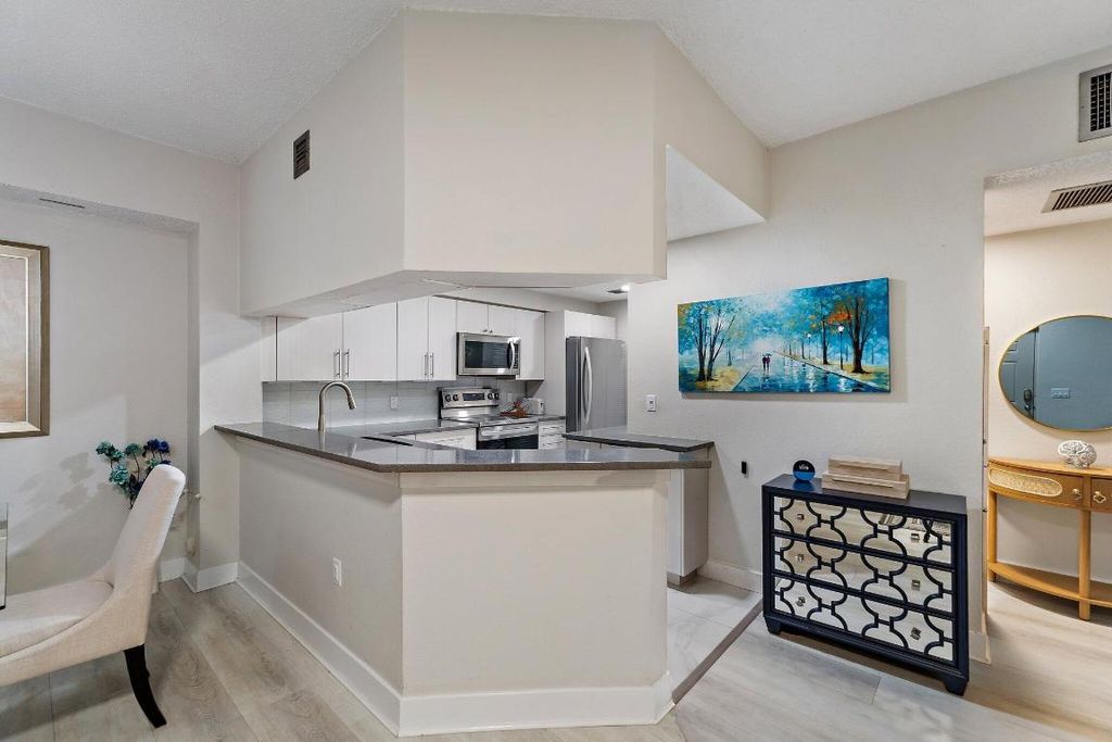 Photo of 3021 Alcazar Place #103, Palm Beach Gardens, FL 33410 (MLS # R11153950)