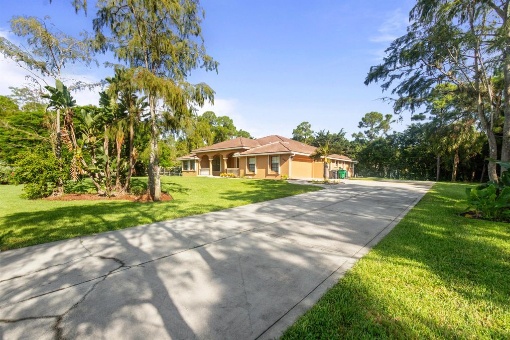 Photo of 15807 Citrus Grove Boulevard, Loxahatchee, FL 33470 (MLS # R11030894)