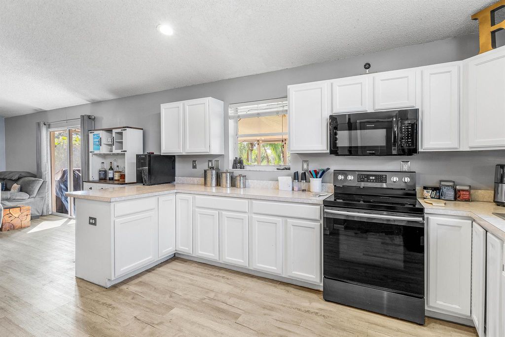 Photo of 18308 Murcott Boulevard, The Acreage, FL 33470 (MLS # R11135010)