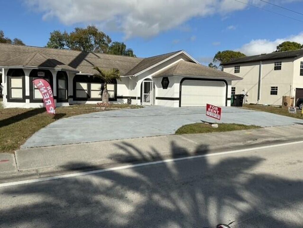 Photo of 557 SE Port St Lucie Boulevard, Port Saint Lucie, FL 34984 (MLS # R11159104)