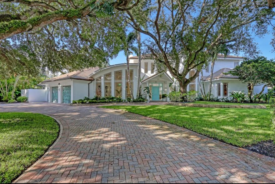 Welcome to 2338 Flamingo Road, a completely remodeled waterfront estate in the heart of Palm Beach Gardens. This luxurious 5-bedroom, 5.1-bathroom home offers top-of-the-line upgrades, modern finishes, and a layout designed for comfort, entertaining, and effortless indoor-outdoor living. Available seasonally or annually—call for more pricing details. The home features two primary suites one on the main level and one upstairs each with separate his-and-hers walk-in closets. The upstairs suite also includes a loft and a spacious terrace with peaceful waterfront views.

The chef's kitchen is equipped with a commercial-grade 8-burner gas range, an oversized 15-foot island, a walk-in pantry, a reverse osmosis system, and a whole-home water softener, ideal for cooking, drinking, and wellness. Impact-rated hurricane windows and a whole-house generator provide added protection and peace of mind.

Step outside to your private tropical retreat. The backyard includes a saltwater pool and spa, a covered lounge area, a newly re-thatched tiki hut, and a full outdoor kitchen with a gas grill, Traeger smoker, ice maker, and bar seating. The yard is finished with artificial turf and a putting green for easy maintenance and year-round fun.

For boaters, the private dock includes a 25,000 lb boat lift, an additional slip for boats up to 40 feet, and a floating dock for jet skis. It's just a short boat ride to River House, Waterway Café, Sailfish Marina, and other favorite waterfront dining spots.

Ideally located near high-end shopping, dining, I-95, the Turnpike, and only 20 minutes from Palm Beach International Airport, this home is perfect as a seasonal getaway, investment rental, or full-time residence.

Fully updated and move-in ready, this is South Florida living at its best.