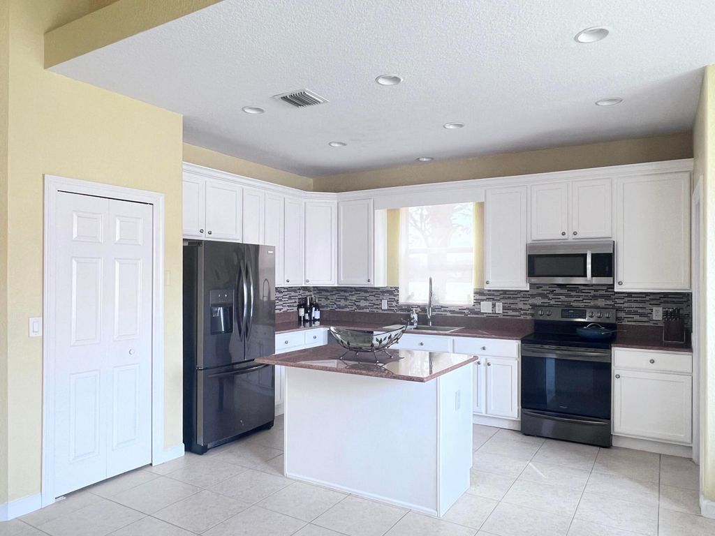 Photo of 8461 W Alister Blvd Boulevard E, Palm Beach Gardens, FL 33418 (MLS # B26013801)