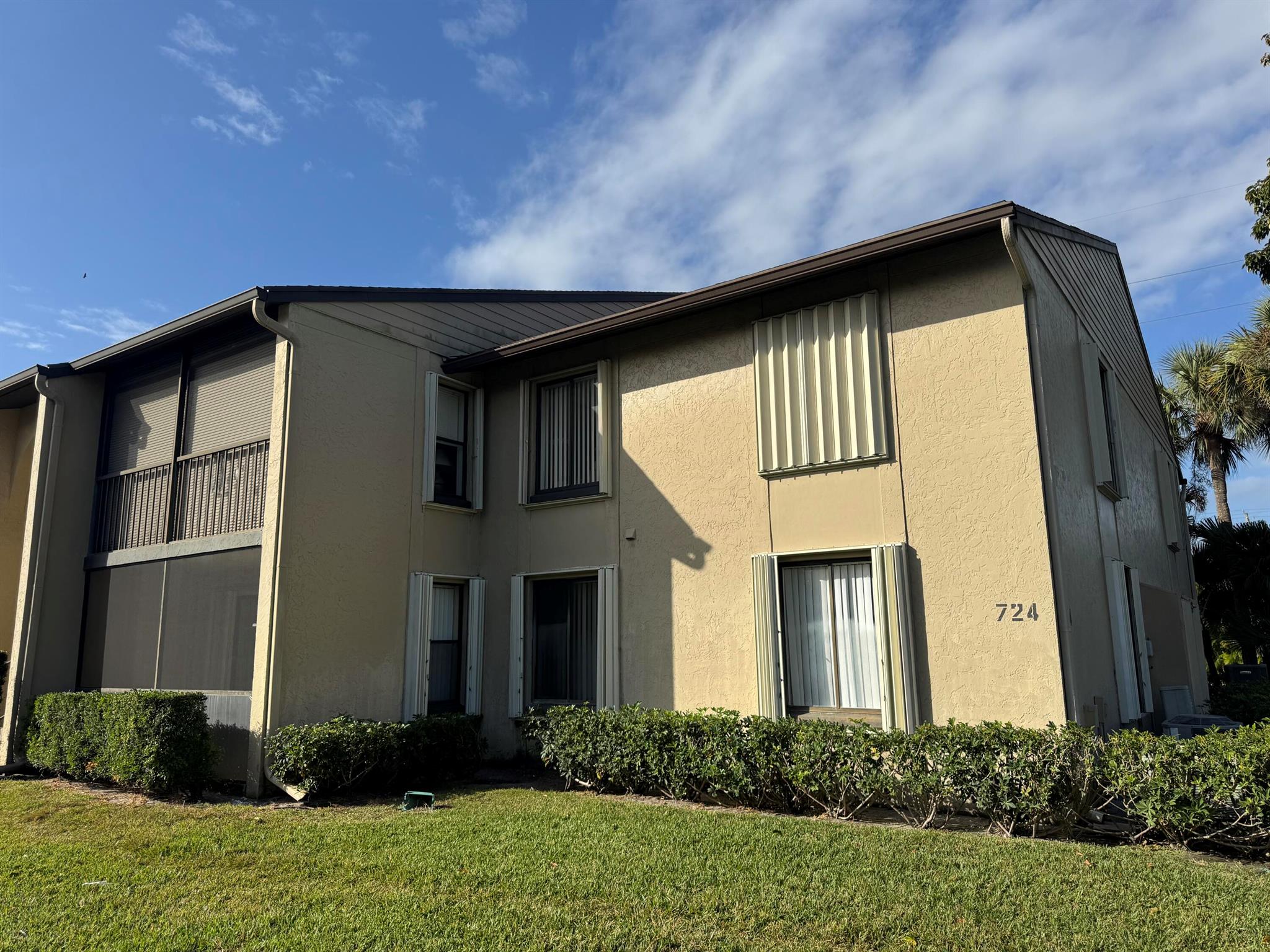 Welcome to Pine Ridge North III in Greenacres! This beautifully updated lake view 2/2 condo is located on the first floor & features wood tile throughout with an updated kitchen featuring granite countertops and new stainless steel appliances. New AC and rest easy with a complete set of accordion shutters for storm protection. Enjoy the convenience of a large utility room with full size washer/dryer inside. Unwind in your private lake view screened-in balcony & make the most out of the spacious layout. This community offers a tranquil setting with well-manicured grounds, a sparkling heated pool and various recreational amenities including tennis/pickleball and walking trails.